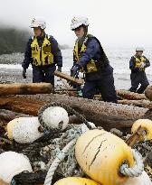 Police comb quake-hit shores in Ishinomaki, Japan