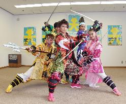 Young Japanese entertainers pose as feudal warlords