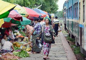 Shoppers at railway platform market in Yangon
