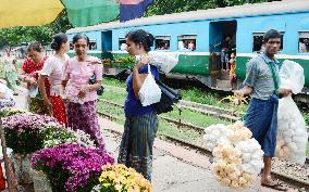 Shoppers on station platform in Myanmar