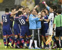 Jubilant Japanese squad after Honda's opening goal
