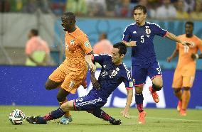 Yoshida tackles Yaya Toure in Japan-Ivory Coast
