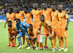 Ivory Coast players pose before facing Japan