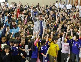 Japan soccer star pictured with kids in Sao Paulo