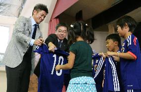 Japan soccer star gives children autograph in Brazil