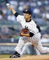 Tanaka earns 11th win