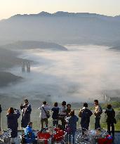 Tourists view sea of clouds at Shimukappu, Hokkaido