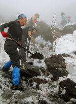 Snow shoveling for opening of Mt. Fuji for climbing