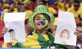 Brazilian supporter cheers at World Cup in Brazil