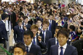 Japan team returns home from Brazil