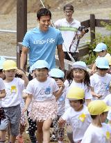 Japan captain Hasebe visits tsunami-hit kindergarten