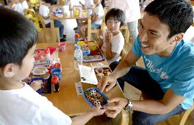 Hasebe with kindergartners in tsunami-hit town