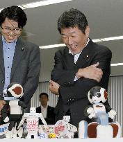 Trade minister visits robot developer in Osaka
