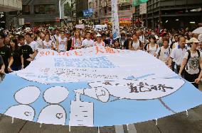 Tens of thousands march in H.K. pro-democracy protest on anniversary