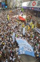 Tens of thousands march in H.K. pro-democracy protest on anniversary
