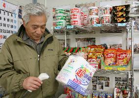 Man shops at unmanned store in Iwate temporary housing