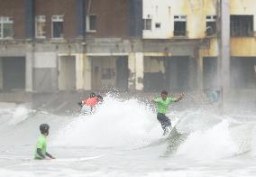 Surfers compete in tsunami-hit Japan area