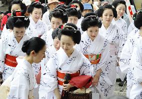 'Geisha' entertainers in summer kimono gather for ritual