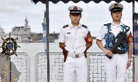 Chinese officers on guard aboard destroyer during RIMPAC