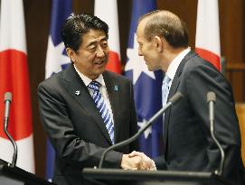 Japan, Australia sign accords on defense equipment, free trade