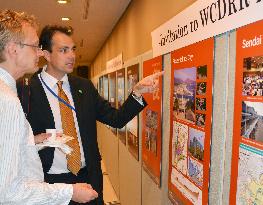 U.N. visitors see photos on 2011 disaster, recovery