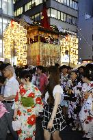 People walk on Kyoto street during Gion Festival