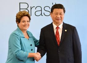 Brazilian, Chinese leaders shake hands at BRICS summit