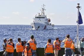 Chinese ship trails Vietnam Coast Guard boat