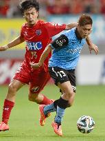 Kawasaki, Tosu J-League players compete for ball