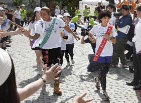 Olympic champ Takahashi in relay for rebuilding disaster-hit areas