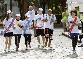 Olympic champ Takahashi in relay for rebuilding disaster-hit areas