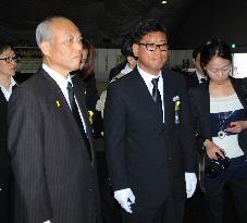 Tokyo governor mourns ferry sinking victims