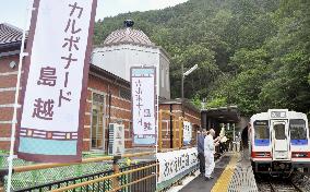Train stops at station repaired after tsunami damage