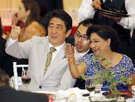 Japan's PM Abe attends dinner with PM Persad-Bissessar
