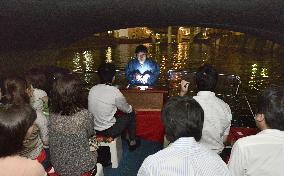 Tour participants listen to ghost story aboard ship