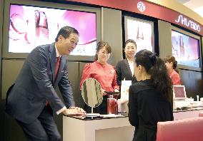 Shiseido chief speaks to customer at Osaka dept. store