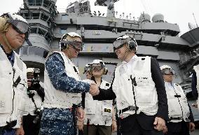Japan defense minister visits U.S. Navy aircraft carrier