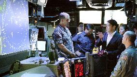 Japan defense minister inspects U.S. aircraft carrier