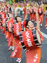 Women parade while beating drums in Morioka Sansa festival