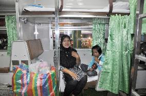 Mother, daughter relax in women-only train car
