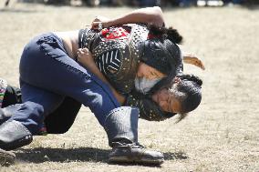 Female wrestlers fight in Mongolia's Naadam sport festival