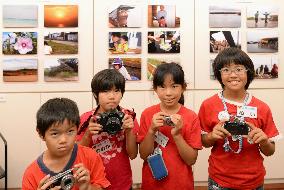 Kids on depopulated Okinawa island hold photo exhibit
