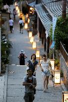 People enjoy cool air at 1,000 lantern-lit Enoshima