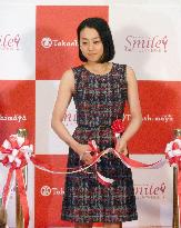 Figure skater Asada cuts ribbon for her photo exhibition