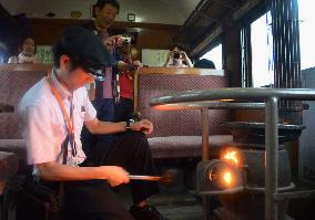 Conductor adds coal on 'stove train' in northern Japan