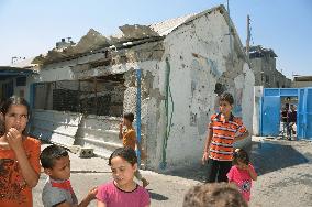 Kids gather at bombed school in Gaza