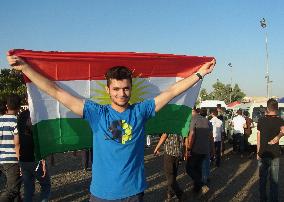 Man with Kurdish flag in Erbil, Iraq