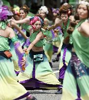 Young women dance in 'Yosakoi' summer festival