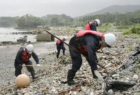 Police look for missing tsunami victims in coastal zone