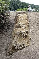 Stones found piled up in staircase pattern at tumulus
